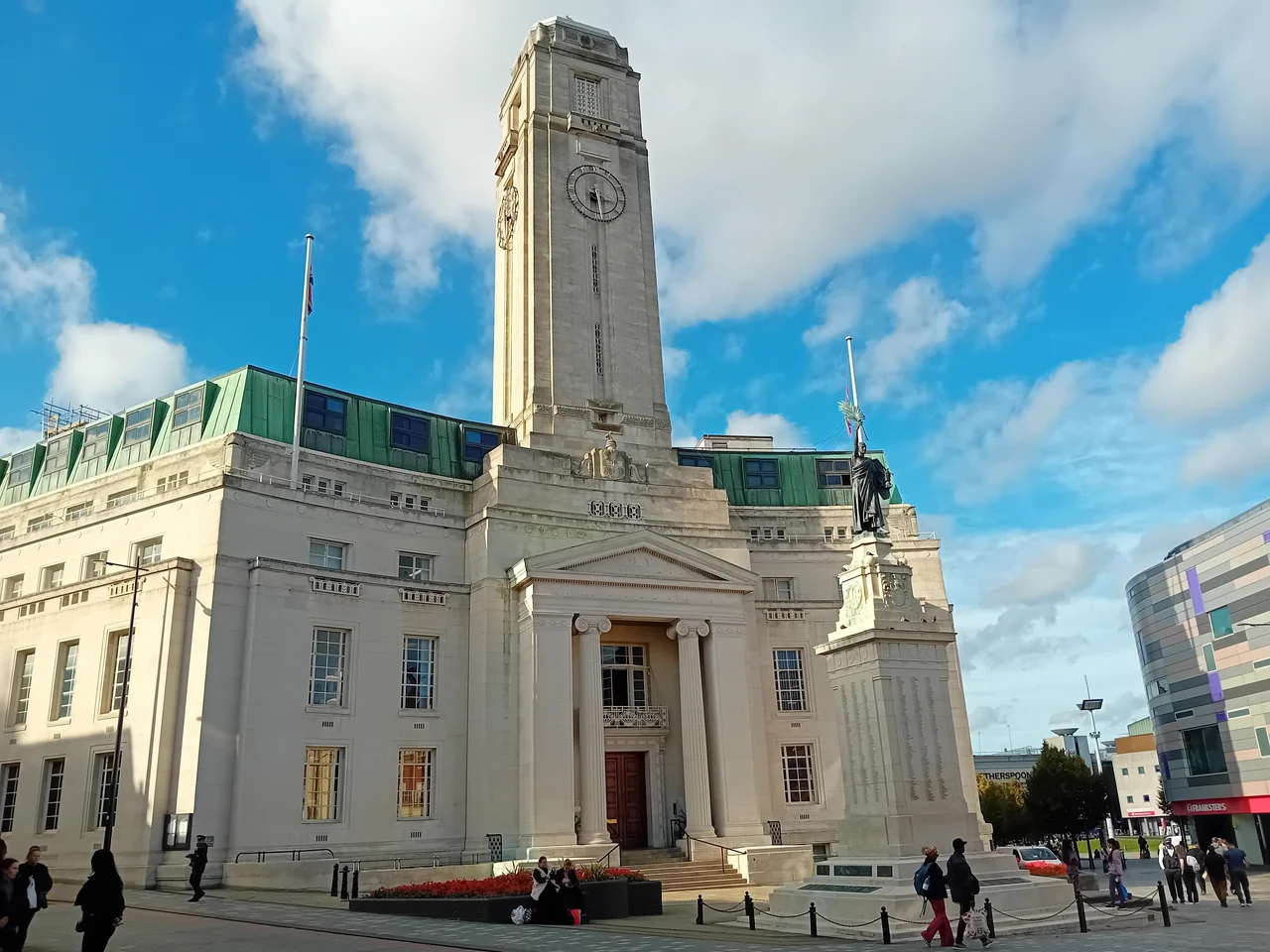 Luton Town Hall and its clock tower under blue sky, photographed in October 2023. Archive view used to illustrate the town.
